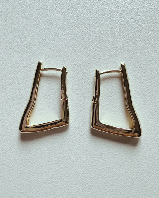 Gold-plated sculpted huggie hoop earrings with modern angular design
